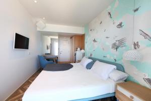 Кровать или кровати в номере Mar Azul Pur Estil Hotel & Spa