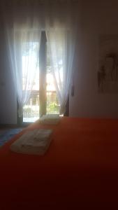 A bed or beds in a room at Sole D'oro IUN S4354