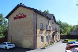 a building with a sign on the side of it at Hotel Teremok Moskovsky in Tver