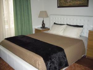 En eller flere senge i et værelse på Casa Vila Palmeira