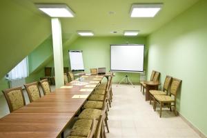 a large conference room with a long table and chairs at Hotel Gościniec Horyzont in Zemborzyce Tereszyńskie