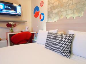 Ένα ή περισσότερα κρεβάτια σε δωμάτιο στο Grand Park Hotel Jerusalem