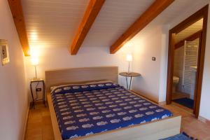 A bed or beds in a room at La Torretta