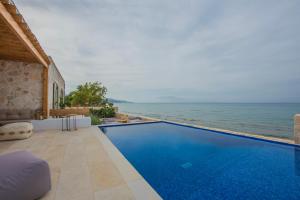 The swimming pool at or close to Niova Villa - Seafront, private pool and Ionian Sea Views, by ZanteWize