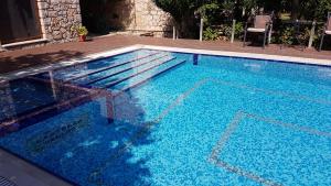 Bazén v ubytovaní Castello Bellos Villas alebo v jeho blízkosti