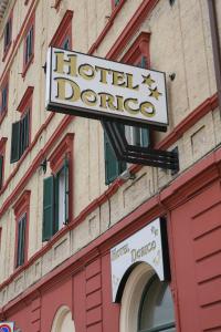 a building with a sign on the front of it at Hotel Dorico in Ancona