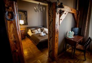 Posteľ alebo postele v izbe v ubytovaní Aparthotel Oberża