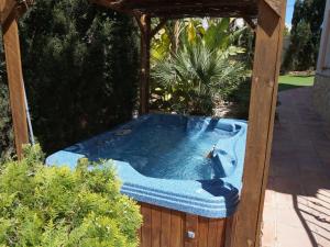 a hot tub in a gazebo in a garden at Belvilla by OYO Villa Jazmin in Albir