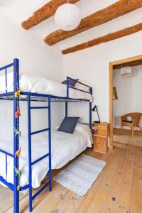 Cama o camas de una habitación en Casa Les Germanes