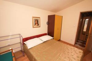 Postel nebo postele na pokoji v ubytování Apartments Mira