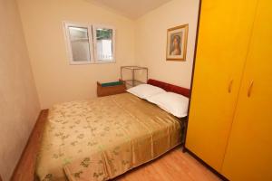 Postel nebo postele na pokoji v ubytování Apartments Mira