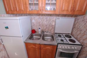 Kuchyň nebo kuchyňský kout v ubytování Apartments Mira