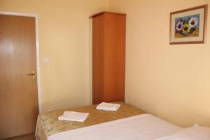 Postel nebo postele na pokoji v ubytování Apartments Mira