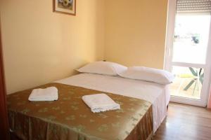 Postel nebo postele na pokoji v ubytování Apartments Mira