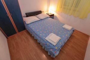 Postel nebo postele na pokoji v ubytování Apartments Mira
