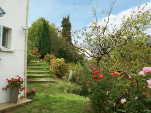 a garden with flowers and stairs in a house at Tranquil Holiday Home in Corsica with Terrace in Penta-di-Casinca
