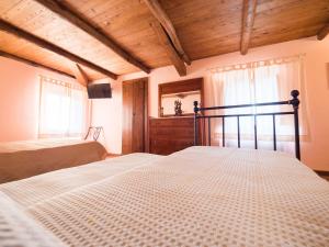 A bed or beds in a room at Il Becco Felice