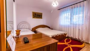 Giường trong phòng chung tại Steaua Nordului