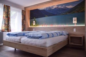 Postel nebo postele na pokoji v ubytování Hotel Posta