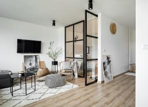 Televízia a/alebo spoločenská miestnosť v ubytovaní udanypobyt Smrekova Apartament