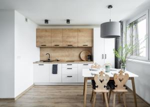 Kuchyňa alebo kuchynka v ubytovaní udanypobyt Smrekova Apartament