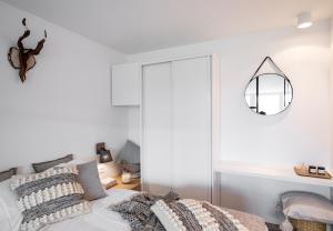 Posteľ alebo postele v izbe v ubytovaní udanypobyt Smrekova Apartament