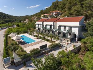 an aerial view of a house with a swimming pool at Hotel Bonaca in Skradin