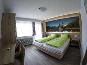 Postel nebo postele na pokoji v ubytování Hotel Posta