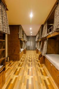 Postel nebo postele na pokoji v ubytování Blossom Dormitory For Male and Female