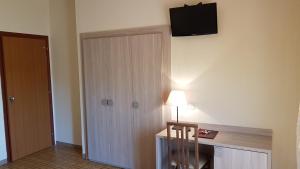 TV a/nebo společenská místnost v ubytování Aparthotel Amelia Dream View