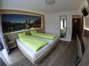 Postel nebo postele na pokoji v ubytování Hotel Posta
