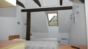 Postel nebo postele na pokoji v ubytování Hommiku Guesthouse