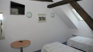 Postel nebo postele na pokoji v ubytování Hommiku Guesthouse