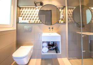 a bathroom with a toilet and a sink at Ona Hotels Mosaic in Barcelona