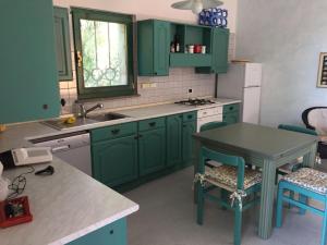 Кухня или мини-кухня в Casa La Pelosa Beach
