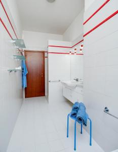 a bathroom with a sink and a blue towel on a stool at Buona Luce in Verona