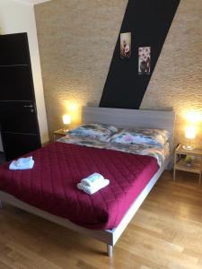 Voodi või voodid majutusasutuse Le Rose dell'Etna - Intero Appartamento toas