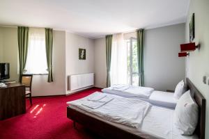 Postel nebo postele na pokoji v ubytování Hotel Walewscy + 25 fotografií