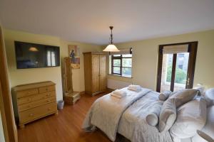 a bedroom with a bed and a dresser and a window at Haddington Place in Dublin