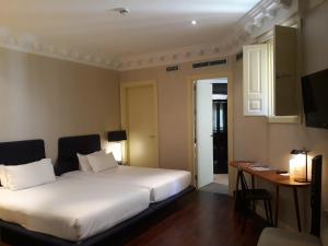 
Cama ou camas em um quarto em Hotel Sardinero Madrid
