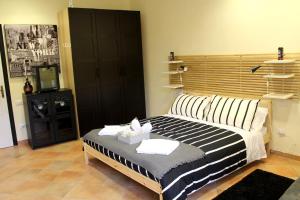 Postel nebo postele na pokoji v ubytování La Sosta Navarra Bed & Beer