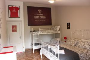 Postel nebo postele na pokoji v ubytování La Sosta Navarra Bed & Beer