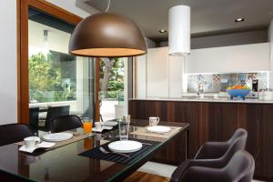 a dining room with a table and chairs at Alba Residence in Split