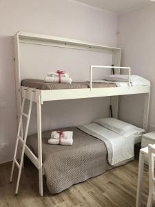 Postel nebo postele na pokoji v ubytování Arco dolce Arco