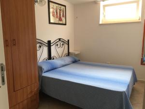 A bed or beds in a room at Casa Vacanza Zia Dani