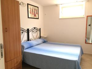 A bed or beds in a room at Casa Vacanza Zia Dani