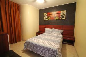 Postel nebo postele na pokoji v ubytování Hotel Chicama