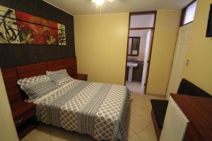 Postel nebo postele na pokoji v ubytování Hotel Chicama