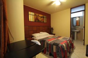 Postel nebo postele na pokoji v ubytování Hotel Chicama