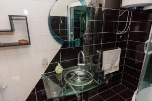 a bathroom with a sink and a mirror at Apartments G&M in Vodice +45 photos